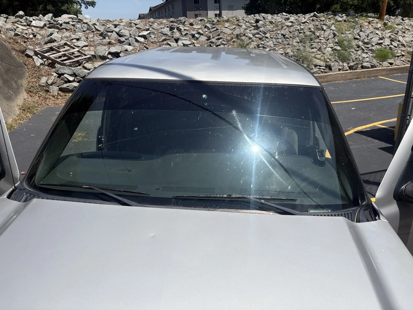 Damaged windshield before the July 2026 Champion Blessing replacement